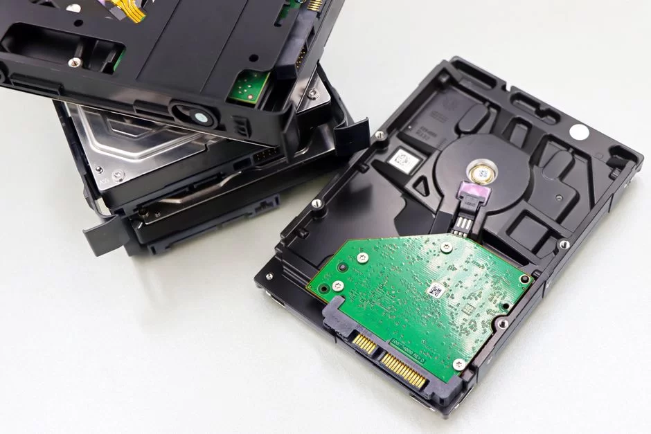 Close-up of an opened computer hard drive (HDD) with physical damage or corruption