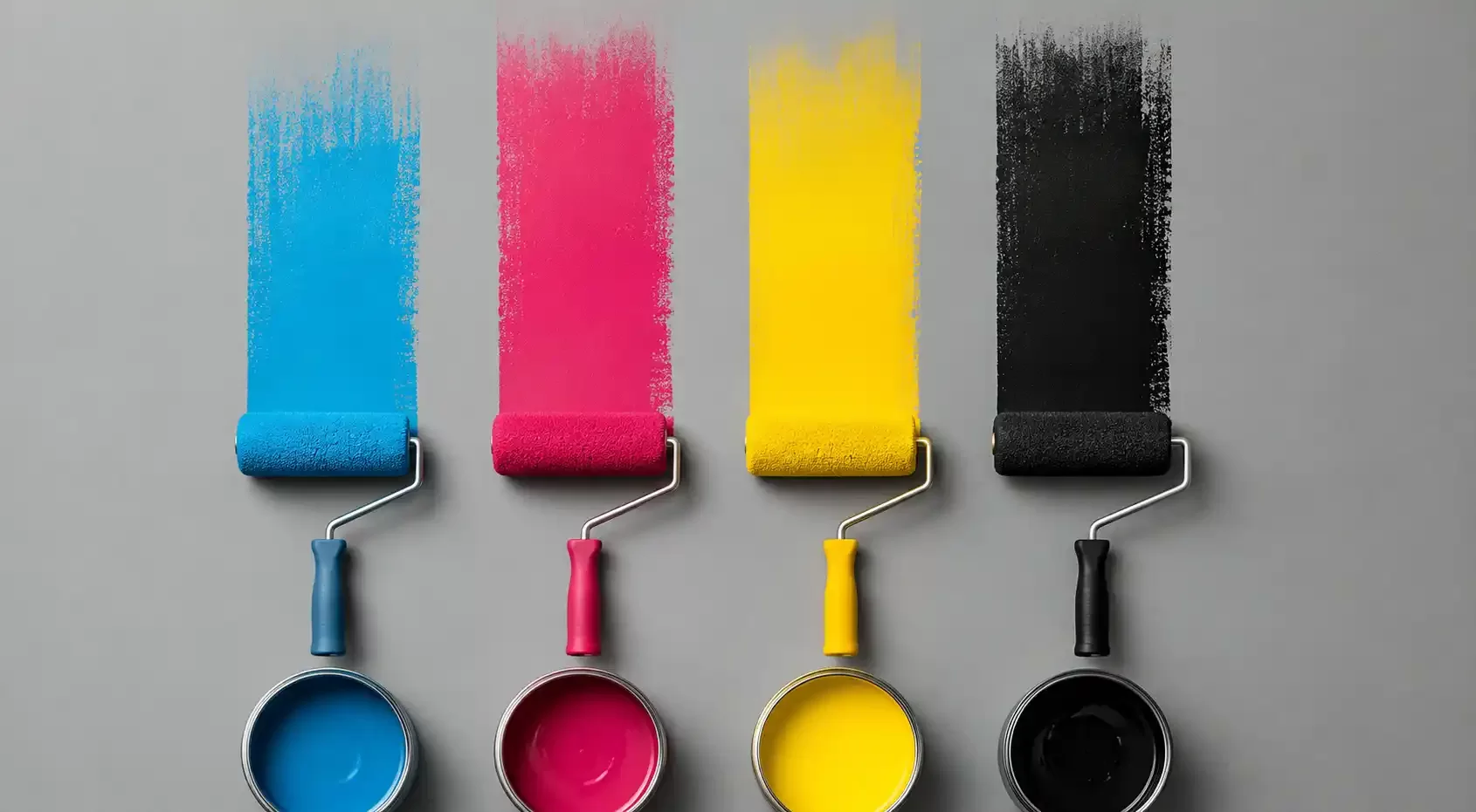 CMYK colors painted with a brush on a flat surface