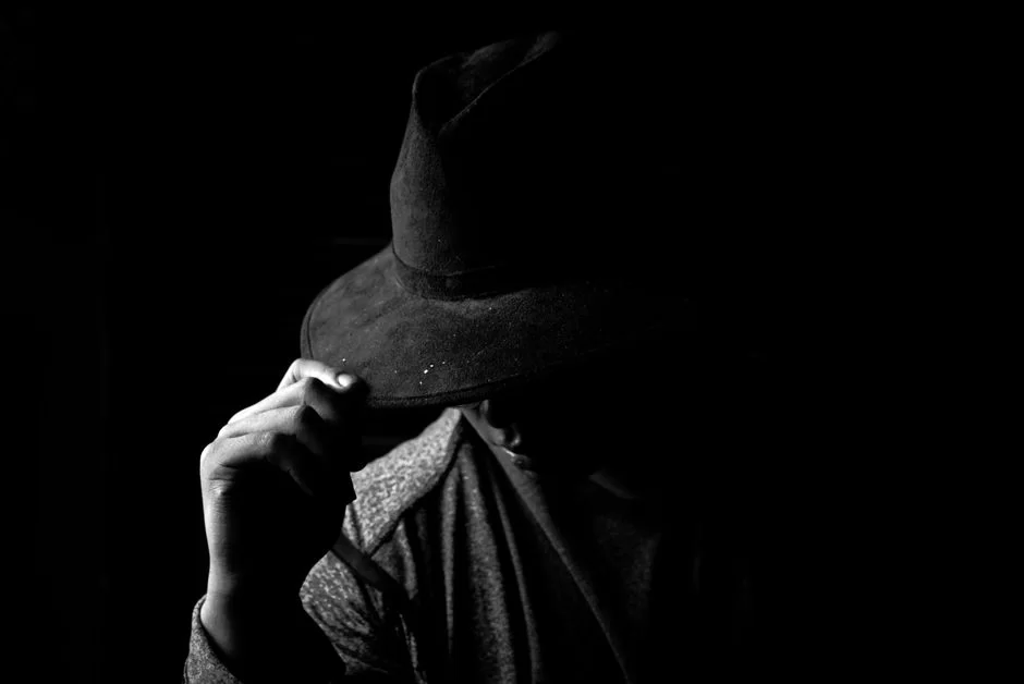Computer user in a black hat, applying shady SEO tactics on a search engine results page
