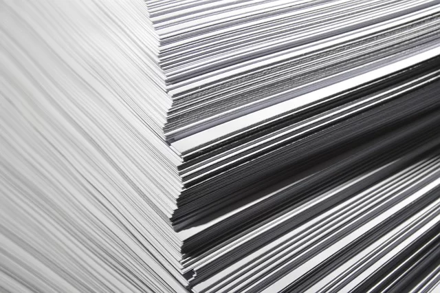 Multiple A3 and A4 papers stacked on top of each other