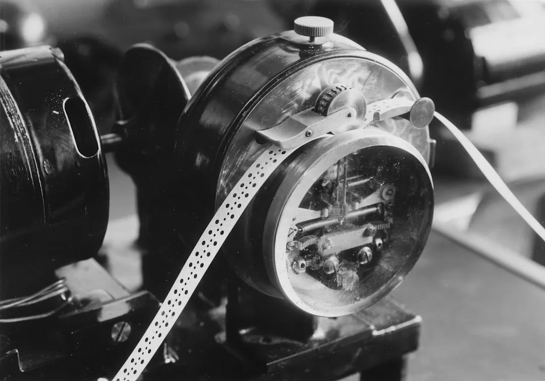 Photo of an old telegraph machine, key, and wires