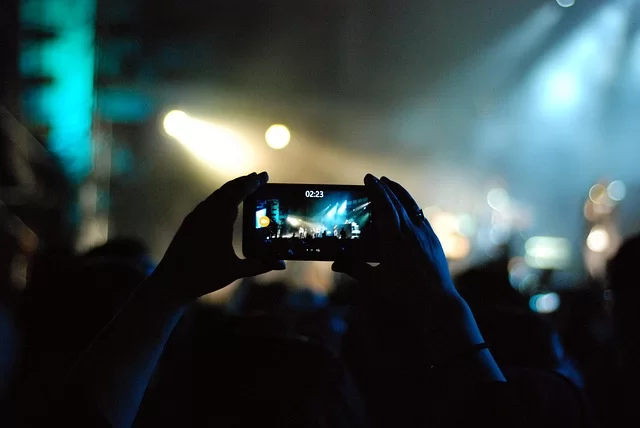 A mobile phone view of a user shooting video in a scene