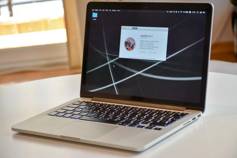 An Apple MacBook laptop sitting on a desk