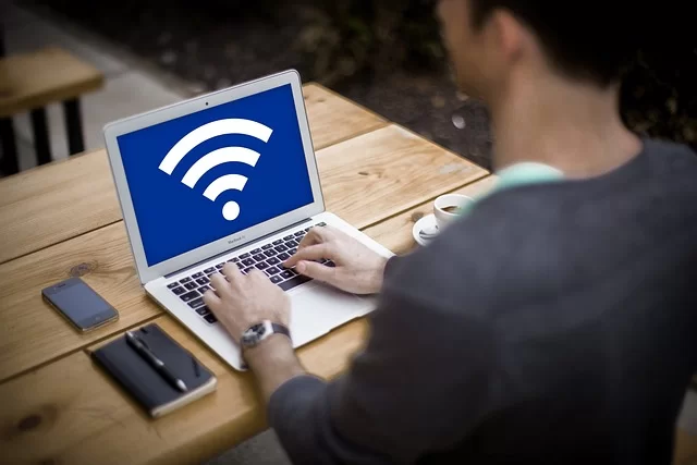 A laptop user image representing wireless security