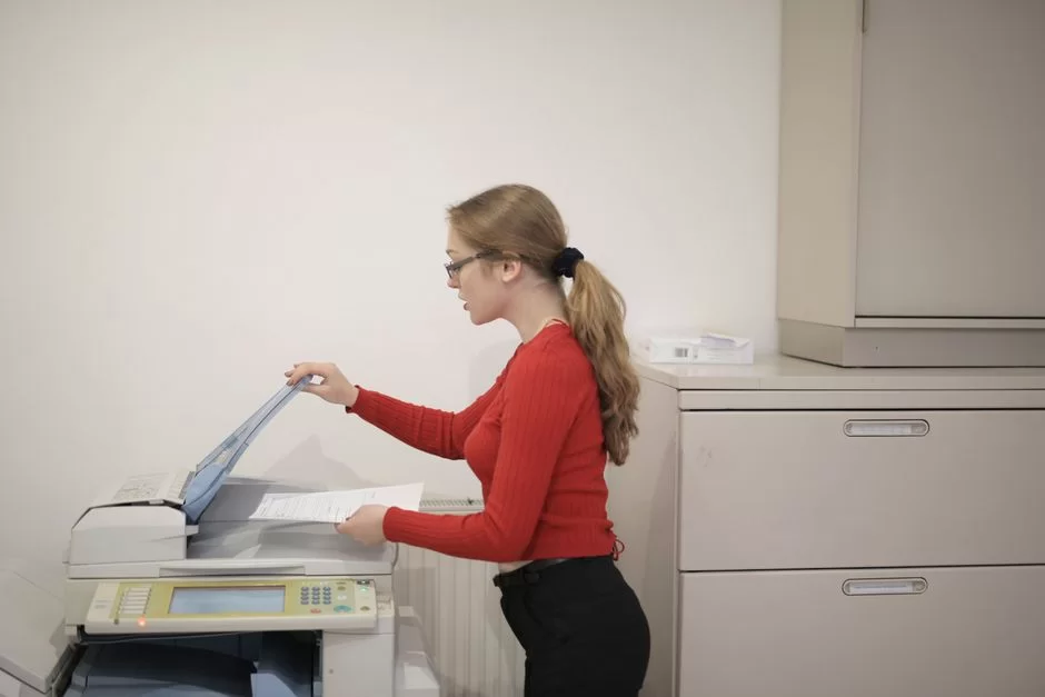 An employee making a photocopy