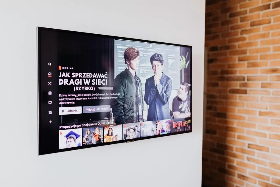 A smart TV hanging on the living room wall
